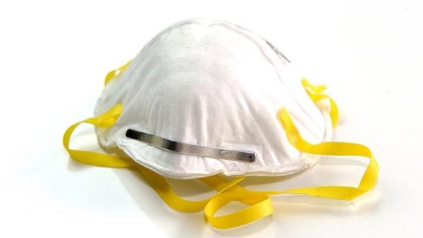 White N95 respirator with yellow straps